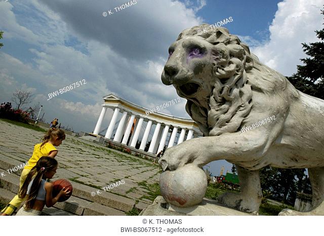 Odessa, Prymorsky bulvar, palace, lion statue with ball, children with ball, Ukraine, Southern Ukraine, Odessa