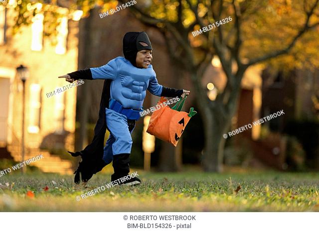 African American boy trick-or-treating on Halloween