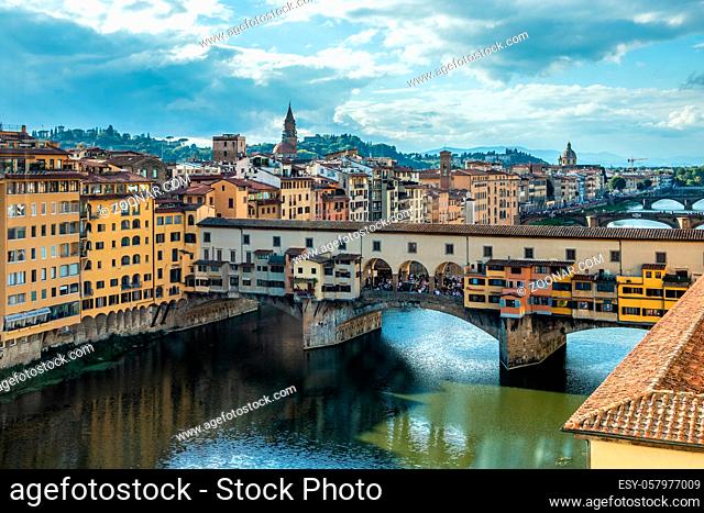 FLORENCE, TUSCANY/ITALY - OCTOBER 19 : View of buildings along and across the River Arno in Florence on October 19, 2019. Unidentified people