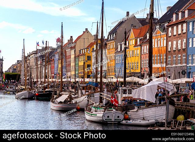 Copenhagen, Denmark - September 02, 2017: Famous Nyhavn harbor with boats in the historical city centre