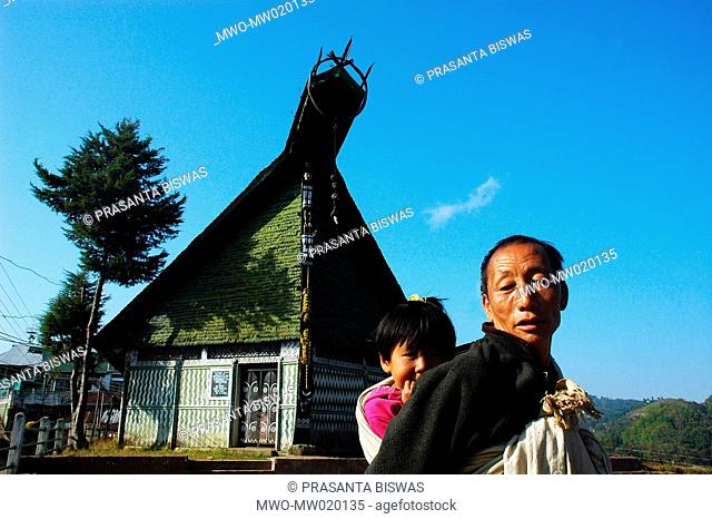 A man from the ethnic Naga community with his grand daughter, in the village of Ungma, 10 kilometers south from Mokochung town, in Nagaland, India Nagaland