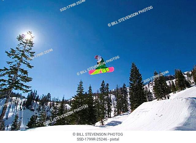 Low angle view of a man snowboarding