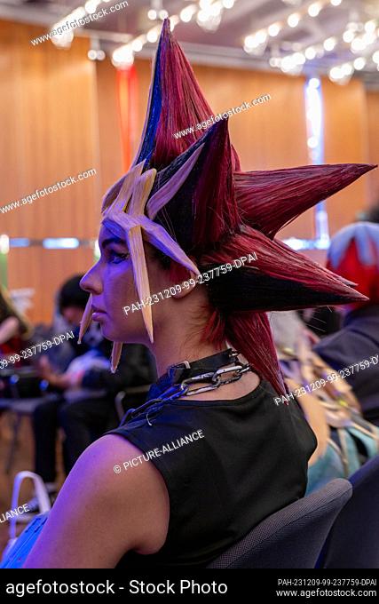 09 December 2023, Bavaria, Coburg: A young woman waits for her appearance at a costume competition. The German Xmas Con, a trade fair for anime