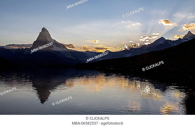 The Matterhorn reflected in lake stellisee the last light of sunset, Zermatt valley, Valais-Wallis Canton, Switzerland