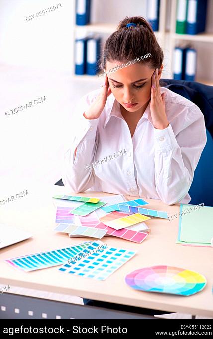 Female beautiful designer working in the office