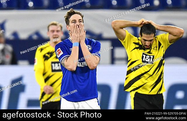20 February 2021, Gelsenkirchen: Football: Bundesliga, Matchday 22, FC Schalke 04 - Borussia Dortmund at Veltins Arena. Schalke's Bastian Oczipka reacts after...