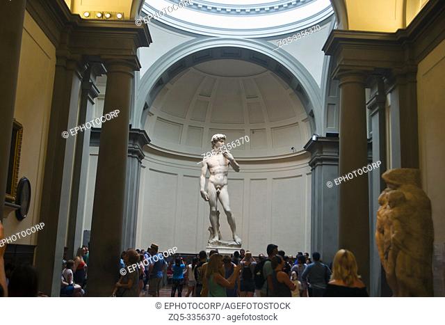 FLORENCE, ITALY, July 2018, Tourist watch the statue of DAVID by Michelangelo at Florence's Accademia gallery