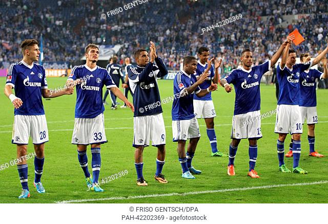 Schalke's Adam Szalai (L-R), Roman Neustaedter, Kevin-Prince Boateng, Jefferson Farfan, Joel Matip, Dennis Aogo, Julian Draxler and Marco Hoeger celebrate the...