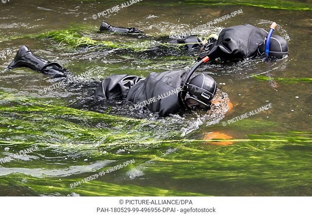 29 May 2018, Germany, Offenburg: Task forces of the water police searching the Muehlbach river near the university of applied sciences in Offenburg as part of...