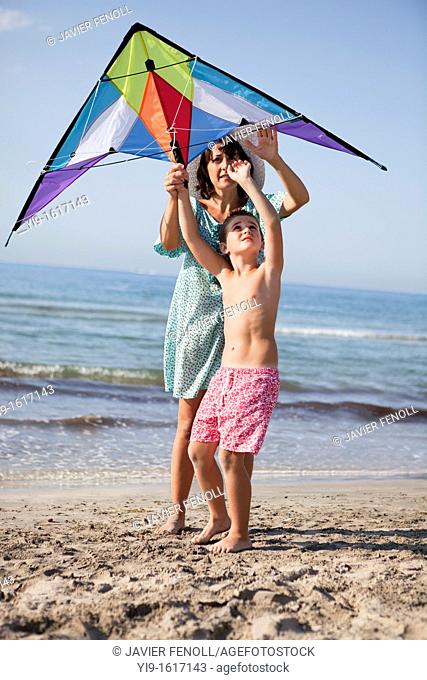 mother and son flying a kite