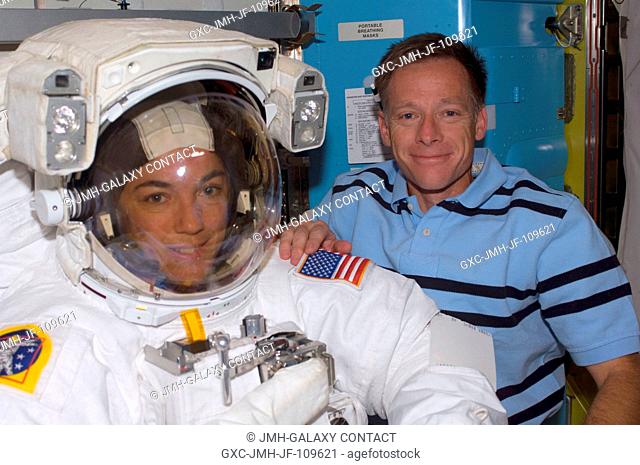 Astronauts Chris Ferguson, STS-126 commander, and Heidemarie Stefanyshyn-Piper, mission specialist, take a moment for a photo during preparations for the...