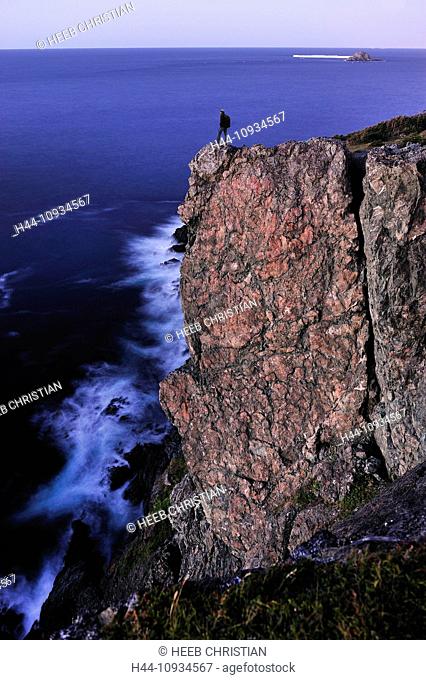 Hiker, standing, edge, high, cliff, ocean, night, Long Point Lighthouse, Crow Head, Newfoundland, Canada
