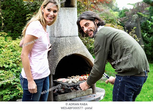 Couple having a barbecue