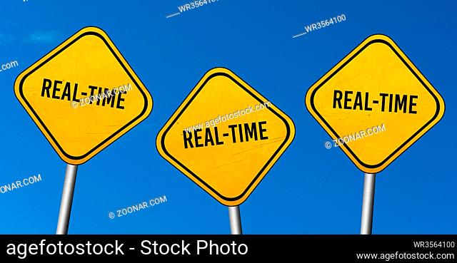 Real-time - yellow signs with blue sky