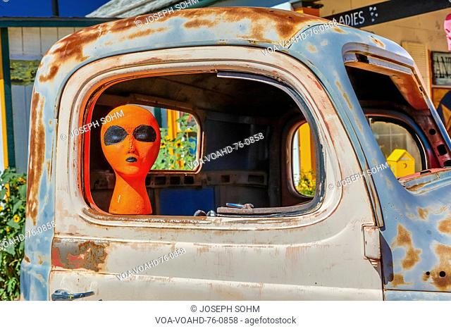 Orange Alien on Main Street in pickup truck, Seligman on historic Route 66, Arizona, USA, July 22, 2016