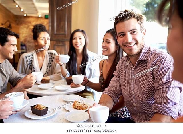 Group Of Friends Meeting In Café Restaurant