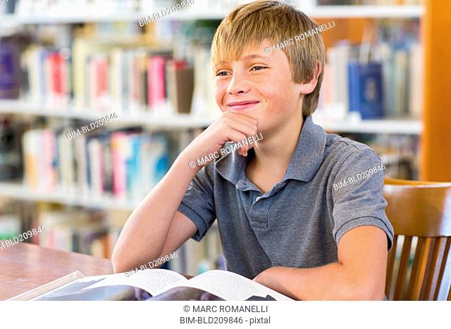Student smiling in library