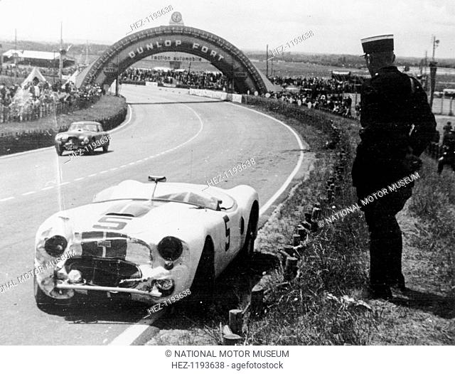 Crashed Cunningham C2-R, Le Mans, France, 1951. A gendarme stands beside the abandoned crashed Cunningham C2-R Chrysler of American drivers George Rand and Fred...