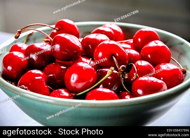 Bunch of organic fresh cherries in a bowl