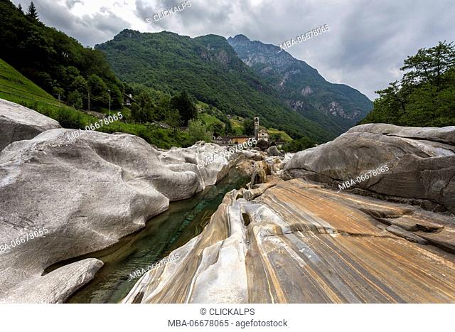 The rocks on the bed of river Verzasca and the church of Lavertezzo, Valle Verzasca, Canton Ticino, Switzerland