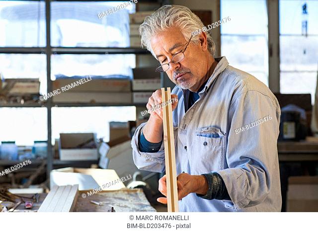 Hispanic craftsman working in studio