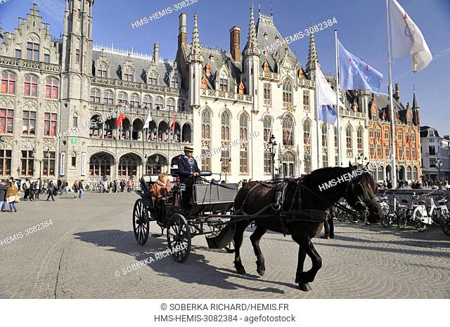Belgium, West Flanders, Bruges, Grand-Place and the Provinciaal Hof or Provincial Palace, horse-drawn carriage tourists