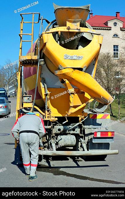 VILNIUS, LITHUANIA - APRIL 13, 2019: Concrete mixer Stetter based on a truck Mercedes drive repairs equipment on a city street. Sunny saturday day