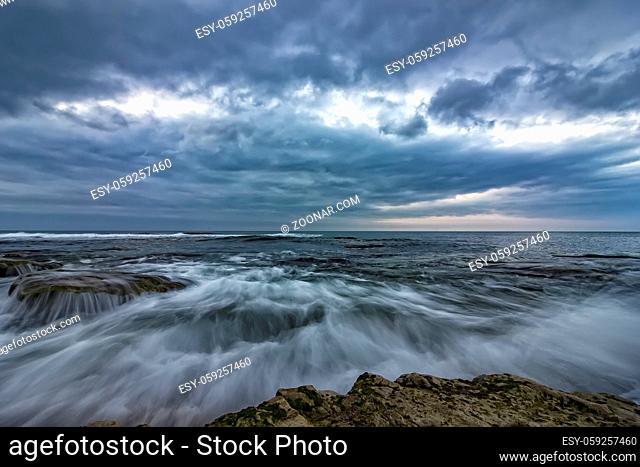 amazing long exposure of the sea waves and rocks at the coast