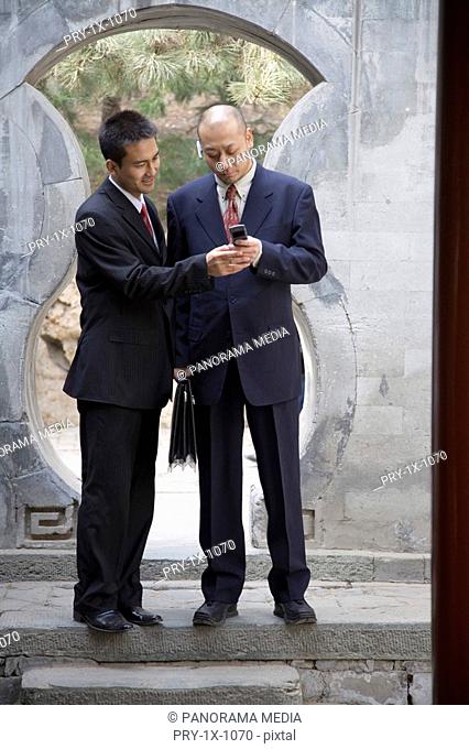 Businessmen with mobile phone