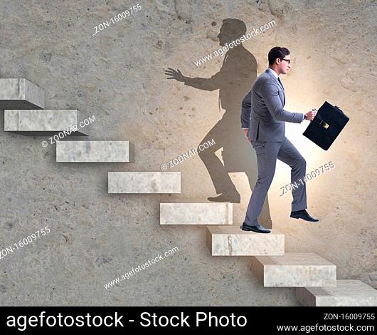 The businessman and his shadow in business concept