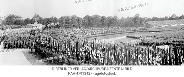 Nuremberg Rally 1934 in Nuremberg, Germany - The contemporary combination picture shows Luitpold Arena with units of the SA (Sturmabteilung) in front of Adolf...