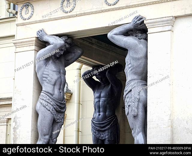 05 November 2019, Russia, St. Petersburg: Sculptures at the ""New Hermitage"", in Saint Petersburg on the Neva River. The entrance is supported by 10 huge stone...