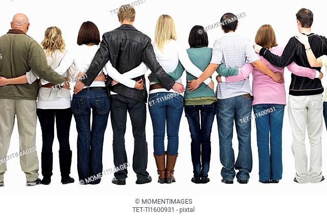 Group of people with their arms around each other's backs