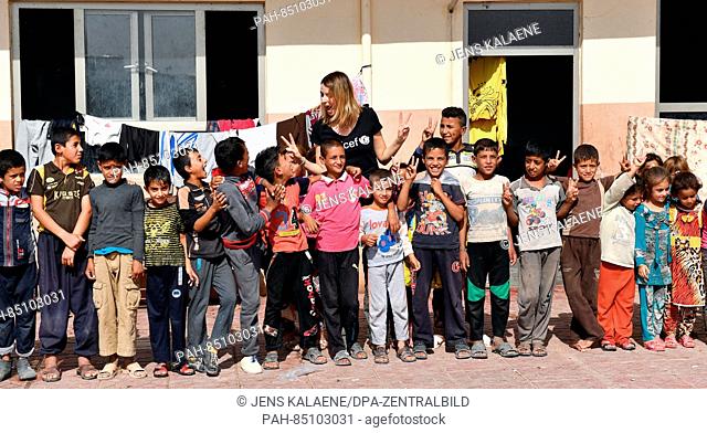 EXCLUSIVE - UNICEF ambassador Eva Padberg is surrounded by children in the Debaga refugee camp between Mosul and Erbil, Iraq, 18 October 2016