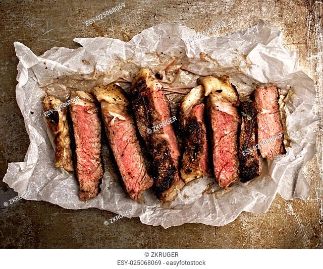 close up of rustic cut juicy barbecue grilled steak