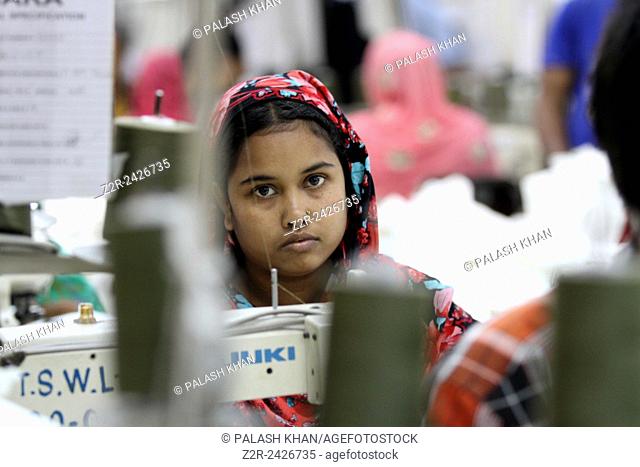 . BANGLADESH, Dhaka : A Bangladeshi woman works in a garments factory in Ashulia Savar in Dhaka on September 24, 2013. Photo by palash khan
