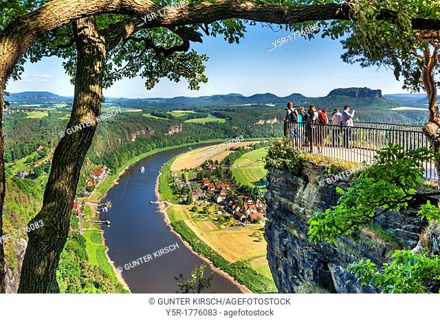 View from the spectacular rock formation Bastei Bastion to health resort Rathen and the Elbe River The Bastei is one of the most visited tourist attractions in...