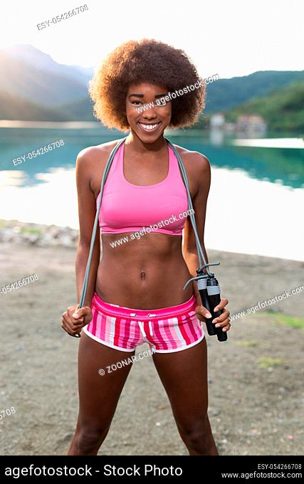 portrait of afro american woman with jump rope