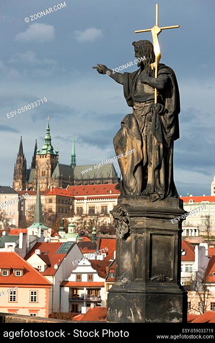 Statue of St.john the Baptist and Prague castle behind