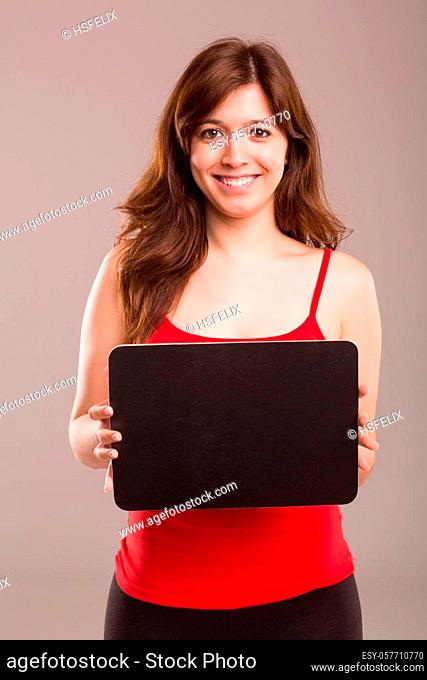 Young beautiful woman holding a small black board