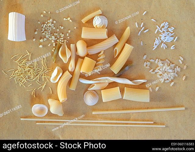 Many different kinds of Italian pasta including penne macaroni (maccheroni) fusilli spaghetti trenette (linguine) orecchiette tortiglioni conchiglie (shells)...