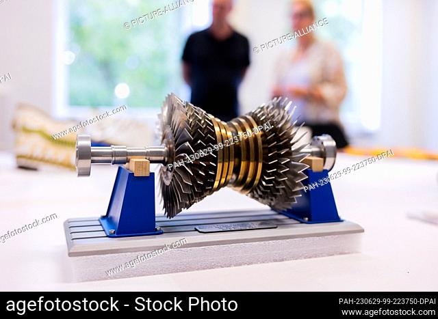 PRODUCTION - 26 June 2023, North Rhine-Westphalia, Duesseldorf: A model of a Siemens Power Generation turbine belonging to former Prime Minister Rüttgers...