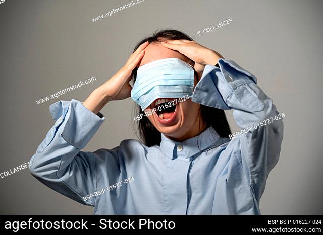 Young woman wearing a mask over her eyes