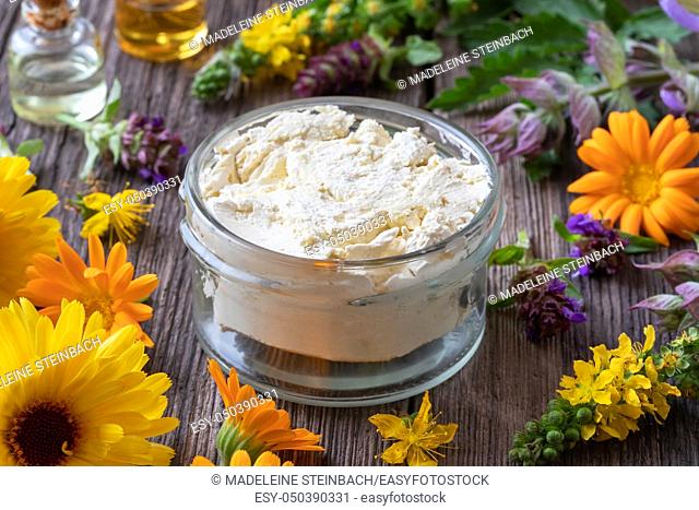 Homemade skin cream made from raw unrefined shea butter, essential oils and medicinal herbs