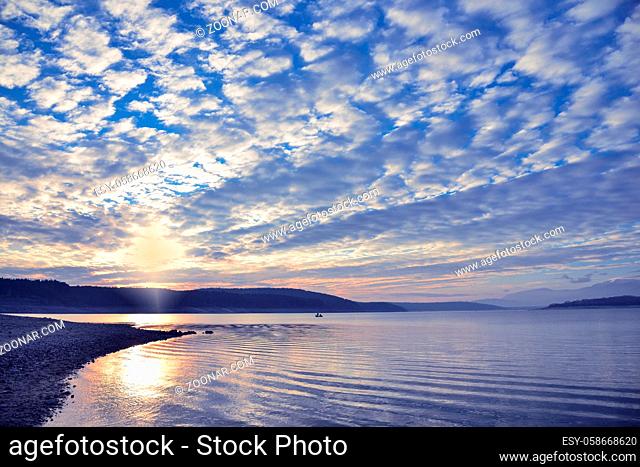 Beautiful Nature Background.Amazing Colorful Clouds.Water Reflections.Magic Artistic Wallpaper.Creative Photography.Blue Sky and Sunset