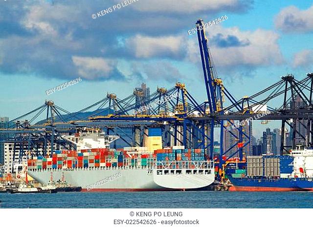 trading seaport with cranes, cargoes and the ship