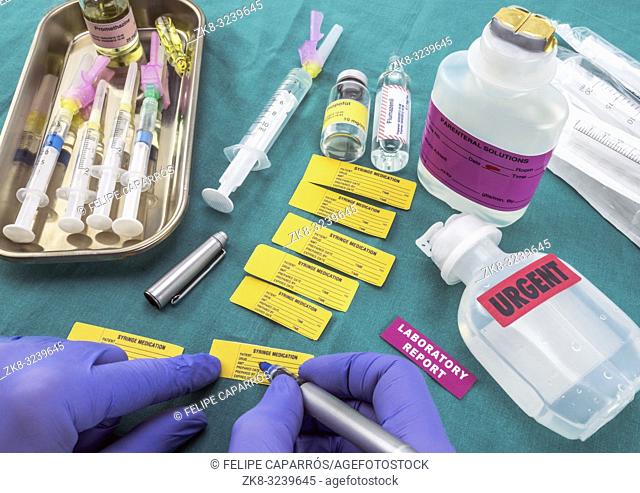 Nurse preparing hospital medication, Write sick data to medical assignment labels, conceptual image, horizontal composition