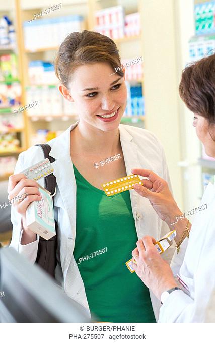 Pharmacist showing generic contraceptive pills