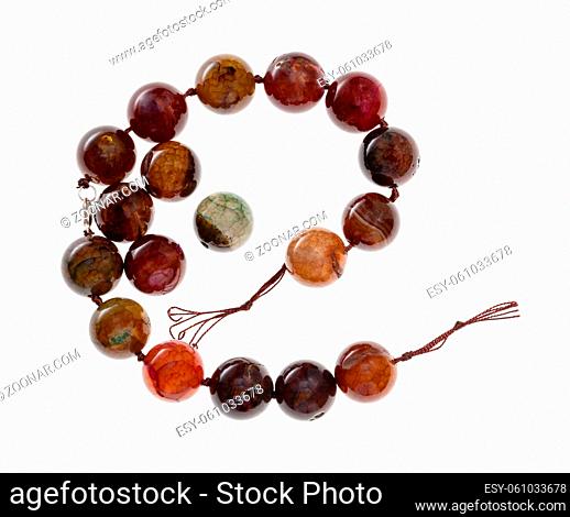 string of beads from cracked agate gemstone isolated on white background