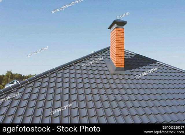 Modern roof made of metal. Corrugated metal roof and metal roofing